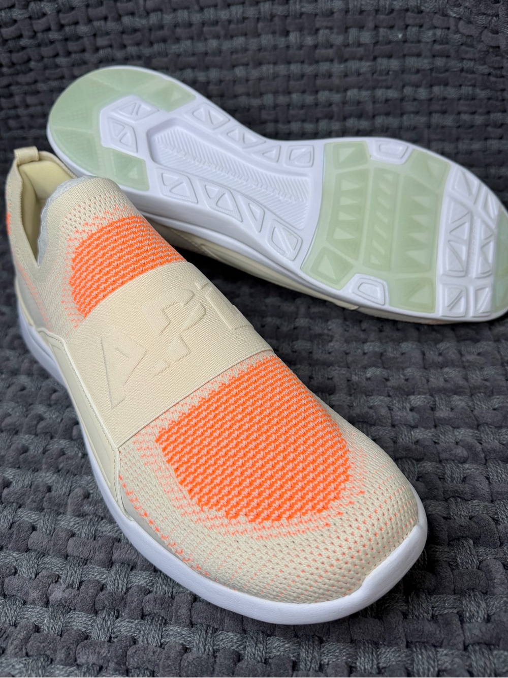 APL Men’s Slip-On Knit Sneaker in Cream and Bright Orange